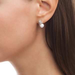 Elegant S925 sterling silver butterfly earrings with pearls and cubic zirconia on model