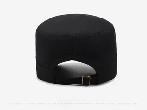 Adjustable back detail of black flat top cap with bronze metal buckle on white background