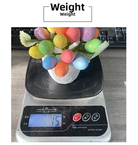 Close-up of a 12cm Easter egg branch weighing 15g on a digital scale for lawn decor