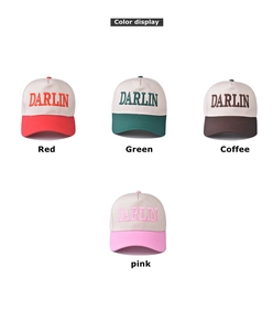 Detail view of four cotton baseball caps with DARLIN embroidery in diverse colorways