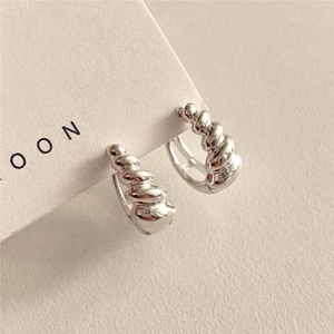 Minimalist 925 sterling silver hoop earrings with a twisted croissant textured design