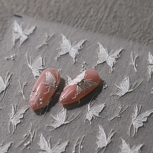3D white embossed butterfly nail stickers on pink glitter nails with TS-3609 patterns