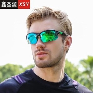 Outdoor male cyclist wearing green reflective sports sunglasses for cycling and running