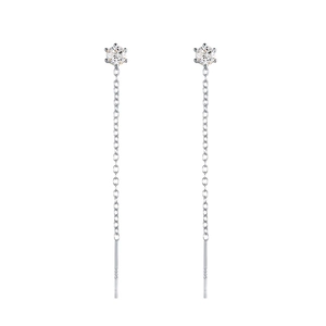 Close-up of silver chain earrings with brilliant round-cut stones in six-prong setting