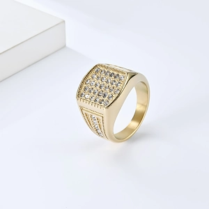 Macro shot of 18K gold-plated hip-hop ring featuring square pavé diamond setting