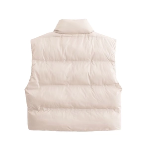 Detail of beige quilted puffer vest showing horizontal stitching and stand-up collar