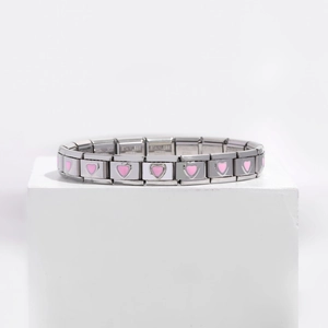 Detail of 9mm stainless steel modular charm bracelet with pink enamel hearts