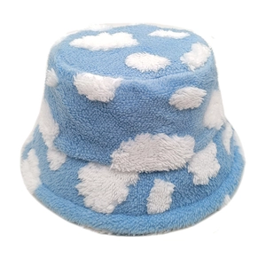 Plush blue fisherman hat with white cloud pattern for winter warmth and outdoor style