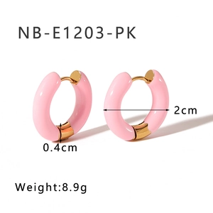 Detail shot of pink enamel hoop earrings with 18K gold plating and 2cm size specs