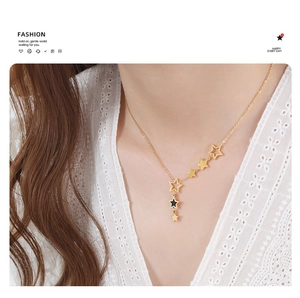 Detail of elegant gold-plated star pendant necklace worn by model on lace background