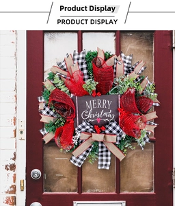 Macro shot of Christmas wreath with buffalo plaid ribbons, red berries and Merry Christmas sign