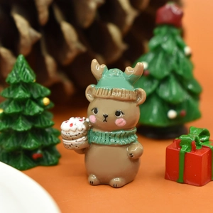 Macro view of a cute Christmas bear resin miniature with green hat and festive decor