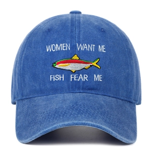 Close-up of fishing embroidery on washed denim baseball cap with funny slogan text