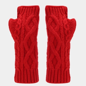 Detail view of red cable-knit fingerless gloves with a thick woven texture for winter