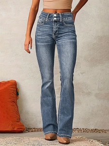 Detail of high waisted blue flared jeans with double buttons and retro washed finish