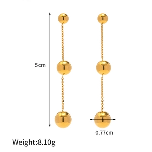 Detailed view showing 5cm length and dimensions of gold ball tassel drop earrings