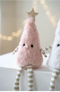 Detail of plush Christmas tree doll with pink faux fur and golden sequin star topper