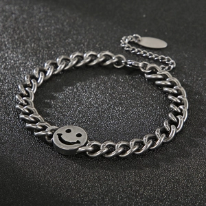 Men's retro stainless steel chain bracelet with a vintage smiley face pendant charm