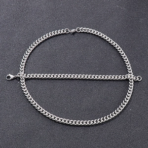 Close-up of polished silver titanium steel Cuban link chain with lobster clasp details