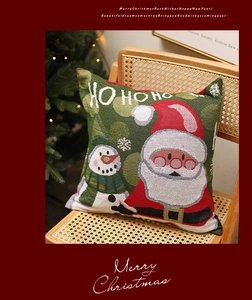 Christmas pillow cover featuring Ho Ho Ho text and Santa pattern on a cozy wooden chair