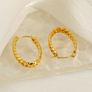 Retro golden twisted braided oval hoop earrings with textured metallic finish for women