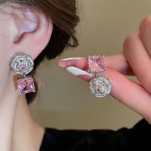 Sparkling camellia flower earrings with square pink zircon drop in polished silver finish