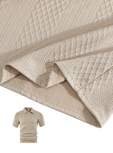 Detail of khaki jacquard knit fabric showing diamond patterns on men's polo shirt