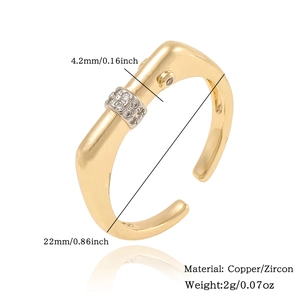 Detail view of golden copper ring with zircon inlay showing 4.2mm width and 2g weight