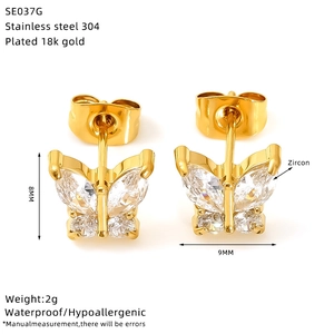 Macro view of 18k gold plated stainless steel bow earrings with zircon stones
