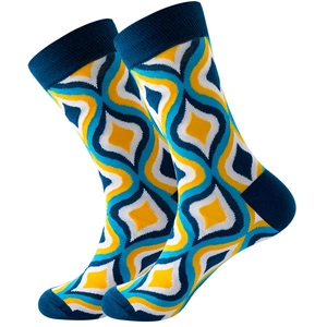 Detail of navy blue and yellow geometric diamond knit patterns on mid-calf socks