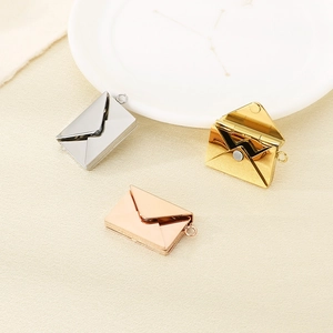 Detailed close-up of openable envelope pendants in silver, gold, and rose gold finishes