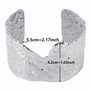 Detail view of 18k gold plated stainless steel cuff bracelet with textured finish and sizing