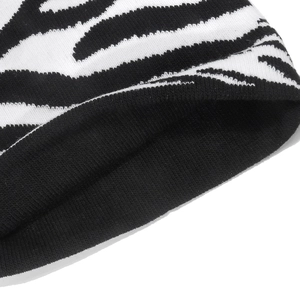 Close-up of zebra pattern knitted fabric texture and fine stitching detail on beanie
