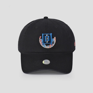 Detailed close-up of a black baseball cap featuring Chinese-style embroidery and wave patterns