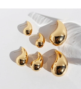 Three pairs of polished gold teardrop earrings in small, medium, and large sizes