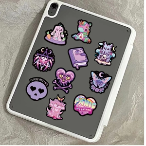 Gothic cartoon stickers set featuring dark cute skulls on a white tablet cover