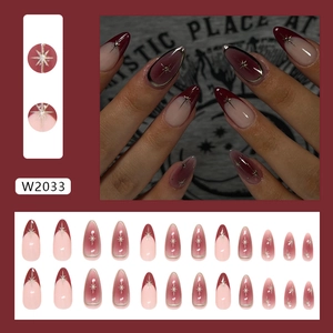 Press on nails with long almond shape, burgundy gradient and silver starburst patterns
