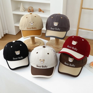 Children's bear embroidered baseball caps in six assorted colors on display