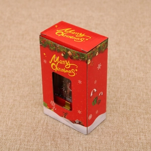 Detail of red Christmas gift box with transparent window and Merry Christmas print