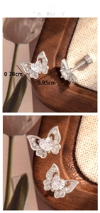 Detail showing butterfly stud earrings with heart zirconia and 0.78x0.95cm size markers