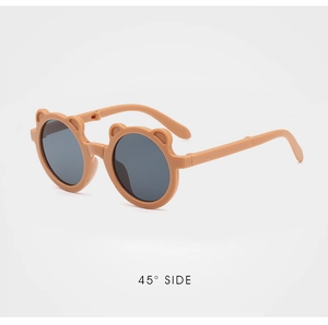 Detailed 45-degree side view of foldable caramel bear-ear sunglasses for kids