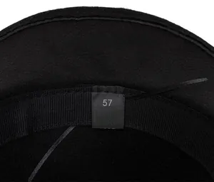 Detail of inner lining and size 57 label on black polyester fedora hat