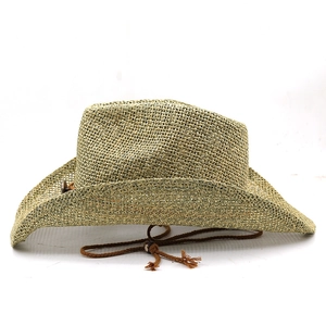 Detail of woven straw cowboy hat with textured mesh pattern and brown tassel chin strap