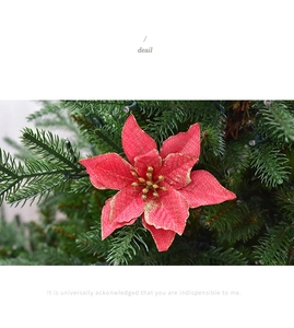 Close-up of a 13cm red velvet poinsettia with gold glitter edges for Christmas tree decor