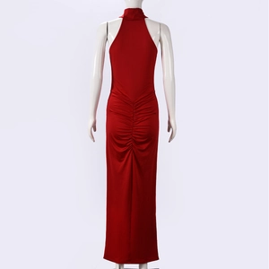 Close-up of the elegant back ruched detail on the red slim-fit halter neck maxi dress
