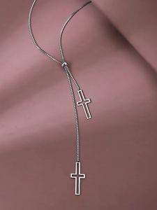 Detail of adjustable box chain with sliding buckle and two hollow cross pendants