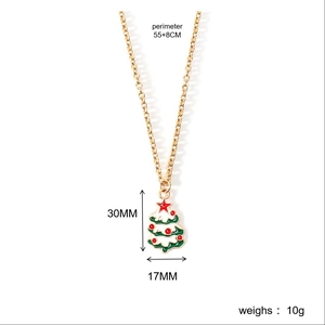 Detailed view of Christmas tree pendant with measurements 30x17mm and 55+8cm gold chain