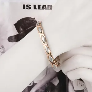 Titanium magnetic therapy bracelet for women in rose gold and silver finish on wrist