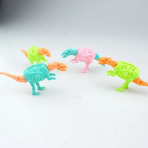 Close-up of four colorful plastic dinosaur skeletons in various vibrant assembly styles