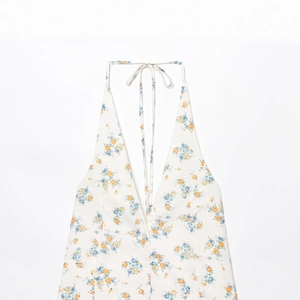 Haut licou blanc avec imprimé floral orange et bleu et décolleté en V profond